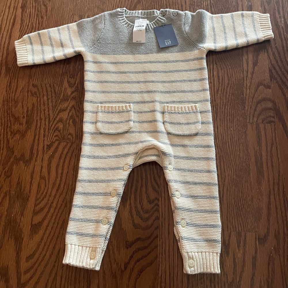 New with tags snaps baby one piece. Super soft sweater material.